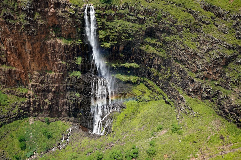 Waimea Canyon on Kauai with its red and green canyon walls and waterfalls